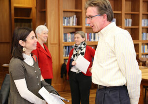 Two UGA faculty members engage in discussion.